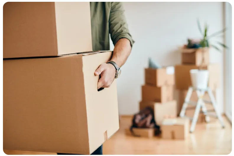 Professional moving service carrying boxes